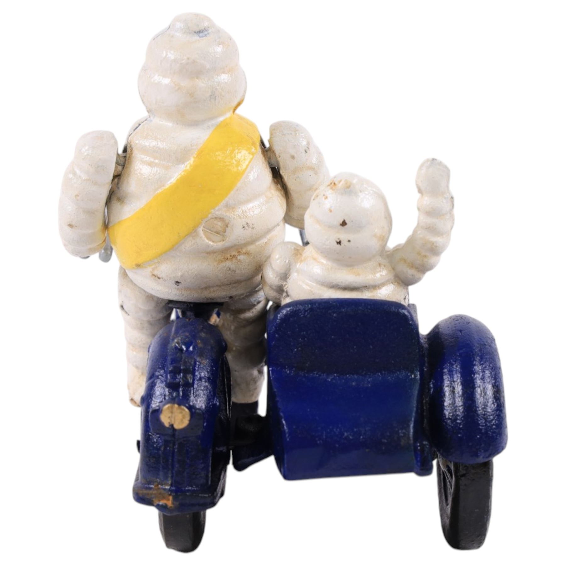 Cast iron figure, modelled as a Michelin man upon a motorbike, H18cm