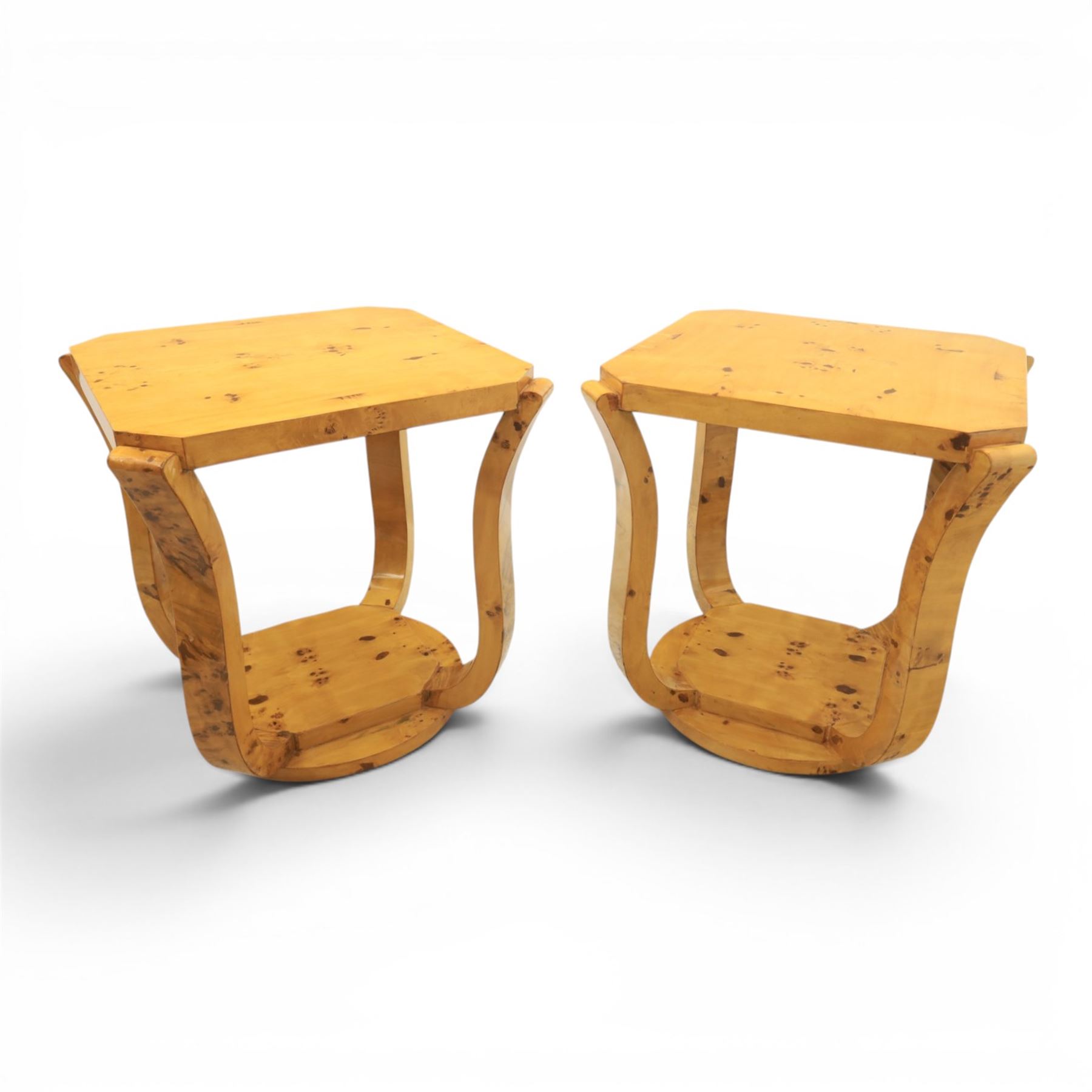 Art Deco style pair of burr walnut lamp tables, octagonal top with rounded corners and book-matched veneers, on four shaped supports united by a circular undertier and plinth base