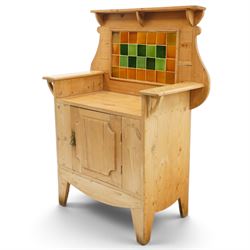 Arts & Crafts pine kitchen cabinet, raised tiled back with projecting shelf and shaped side supports, rectangular work surface above single cupboard door with moulded panel, on square supports
