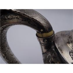 George III silver teapot, of oval form, with embossed foliate, floral and scroll decoration and engraved central cartouche, with acanthus capped C handle with ivory insulators, hallmarked John Emes, London 1807 This item has been registered for sale under Section 10 of the APHA Ivory Act
