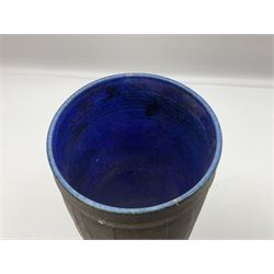 Peter Sparrey contemporary studio pottery vase, of tapering cylindrical form, with rusted metal effect finish and bright blue glazed interior, with impressed mark, H27.5cm
