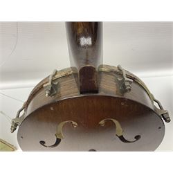 George Formby banjolele with metal plaque to headstock L55cm; in carrying case with instruction booklet.