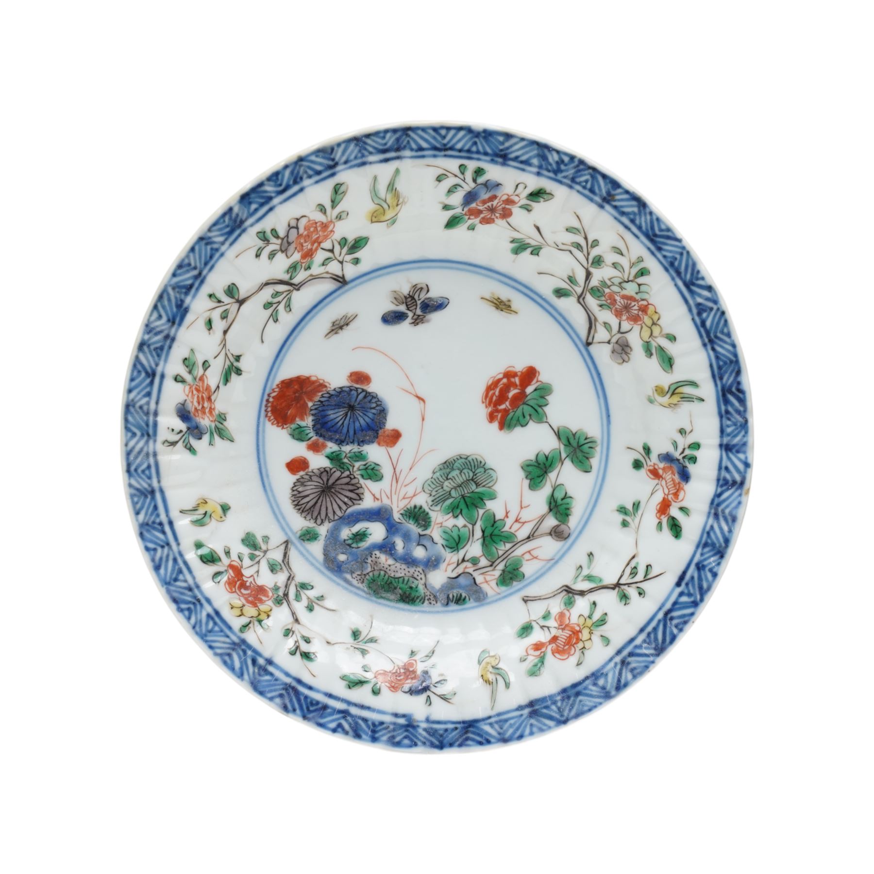 Two Chinese Kangxi period famille verte cafe au lait saucers, decorated with native animals among foliage, with indistinct mark within double rings beneath, D14cm 