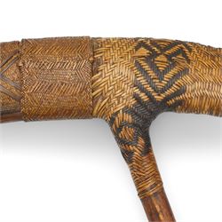 Papua New Guinea presentation ceremonial axe with greenstone head, with intricate fibre binding and wooden haft 77cm across together with a signed copy of Colin Simpson's book 'Adam in Plumes' in which the axe is illustrated 1954