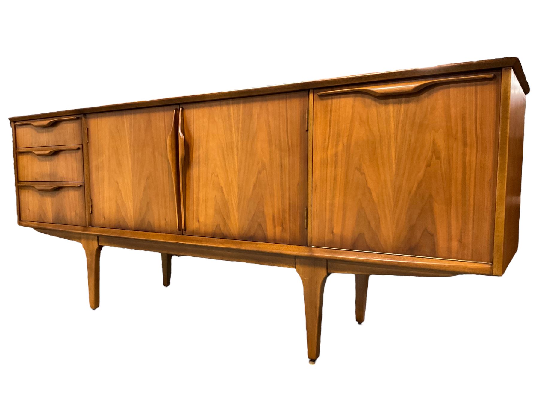 Jentique - mid-20th century teak sideboard, fitted with three drawers, double cupboard and fall front cupboard, raised on tapering supports