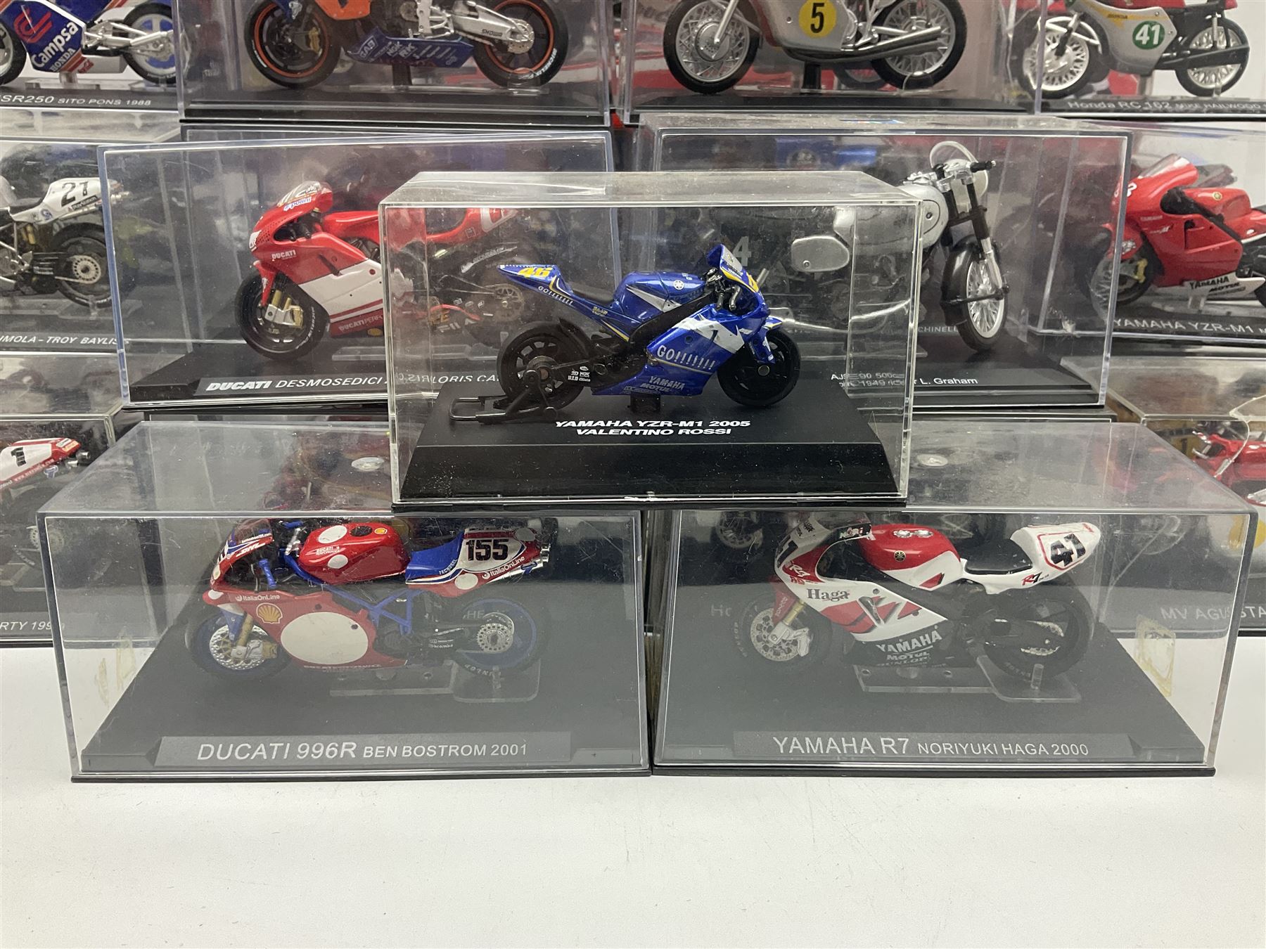 Fifty-one die-cast models of motorcycles by Maisto, Protar Italeri, Welly etc; many in perspex display boxes, some in window boxes and some unboxed