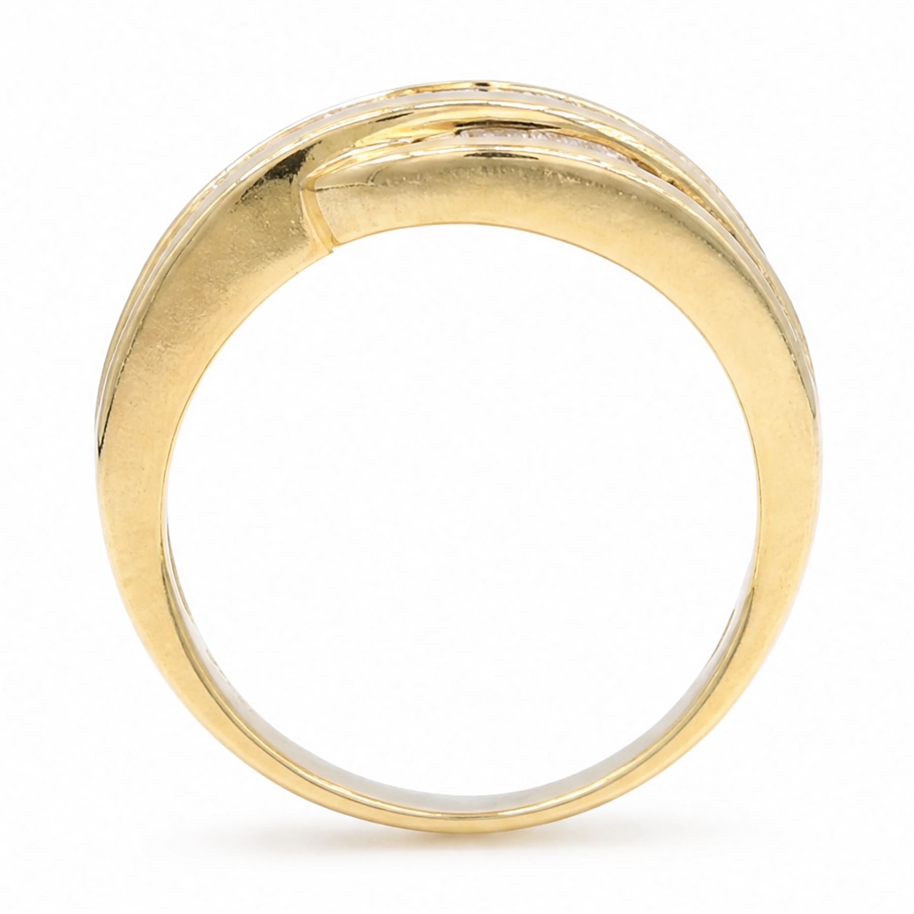 18ct gold diamond crossover ring, channel set with three rows of baguette cut diamonds, 1994