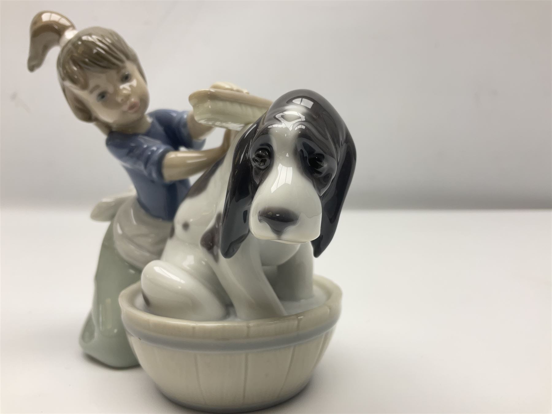 Pair of Lladro figures comprising 'Mis Amigos' model no 5456, and 'Bashful Bather' model no 5455, both with boxes