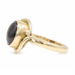 9ct gold black sapphire ring, bezel set with a single cabochon cut sapphire, London 1996