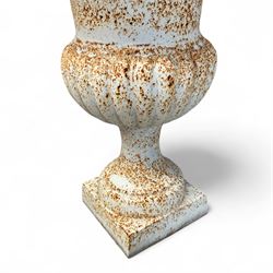 Pair of Victorian design painted cast iron garden urns, egg and dart rim, tapering column on pedestal base