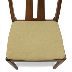 Nathan - teak drop leaf dining table and four Nathan dining chairs, the rectangular top with rounded corners fitted with twin hinged drop leaves and gate legs, extended to form an oval table 174cm in length, raised on square section supports united by stretchers, the chairs with teak frames and padded beige upholstered seat (H 96cm, W 48cm)