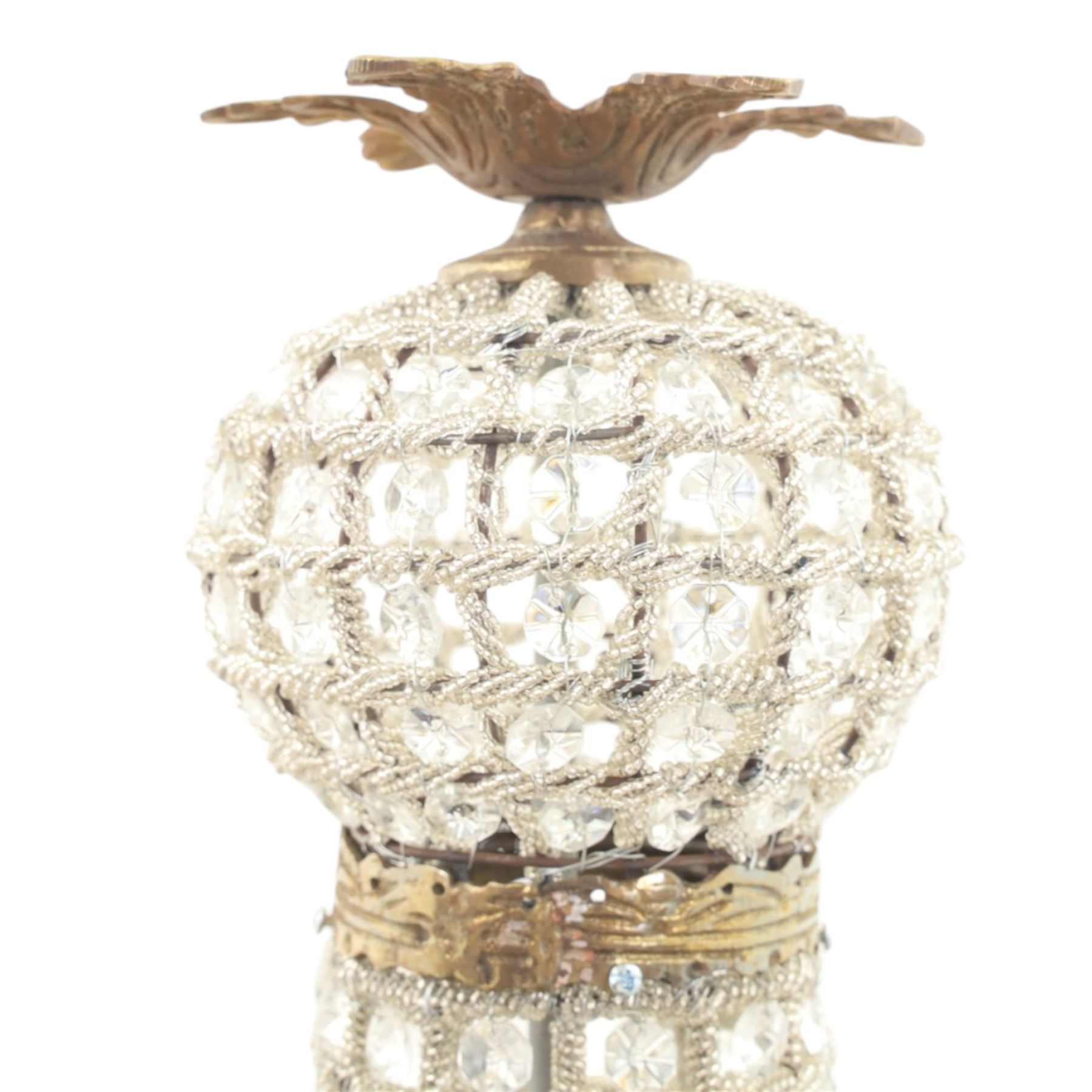 Late 19th century pair of French Empire gilt metal and cut glass bag chandelier, the tapering body formed of faceted glass button drops, with lobed lower bowl, cast foliate and mask mounts, surmounted by a bulbous upper section and terminating with a pendant finial