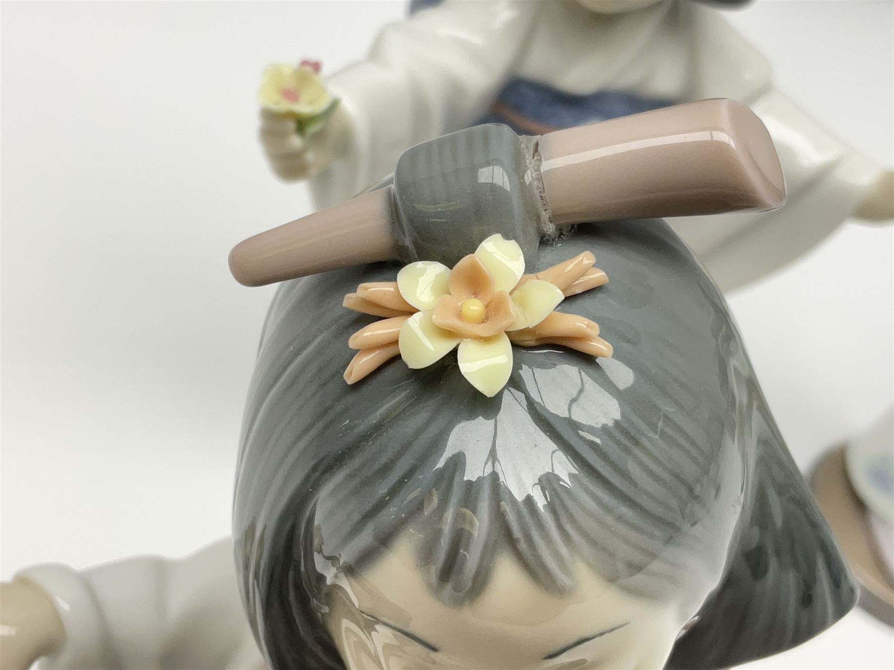 Six Lladro figures of the China doll set and Oriental doll set, comprising Playing the Flute no.6150, Bearing Flowers no.6151, Flower Gazer no. 6152, Oriental Dance no. 6230, Oriental Lantern no. 6231 and Oriental Beauty no. 6232, largest H20cm