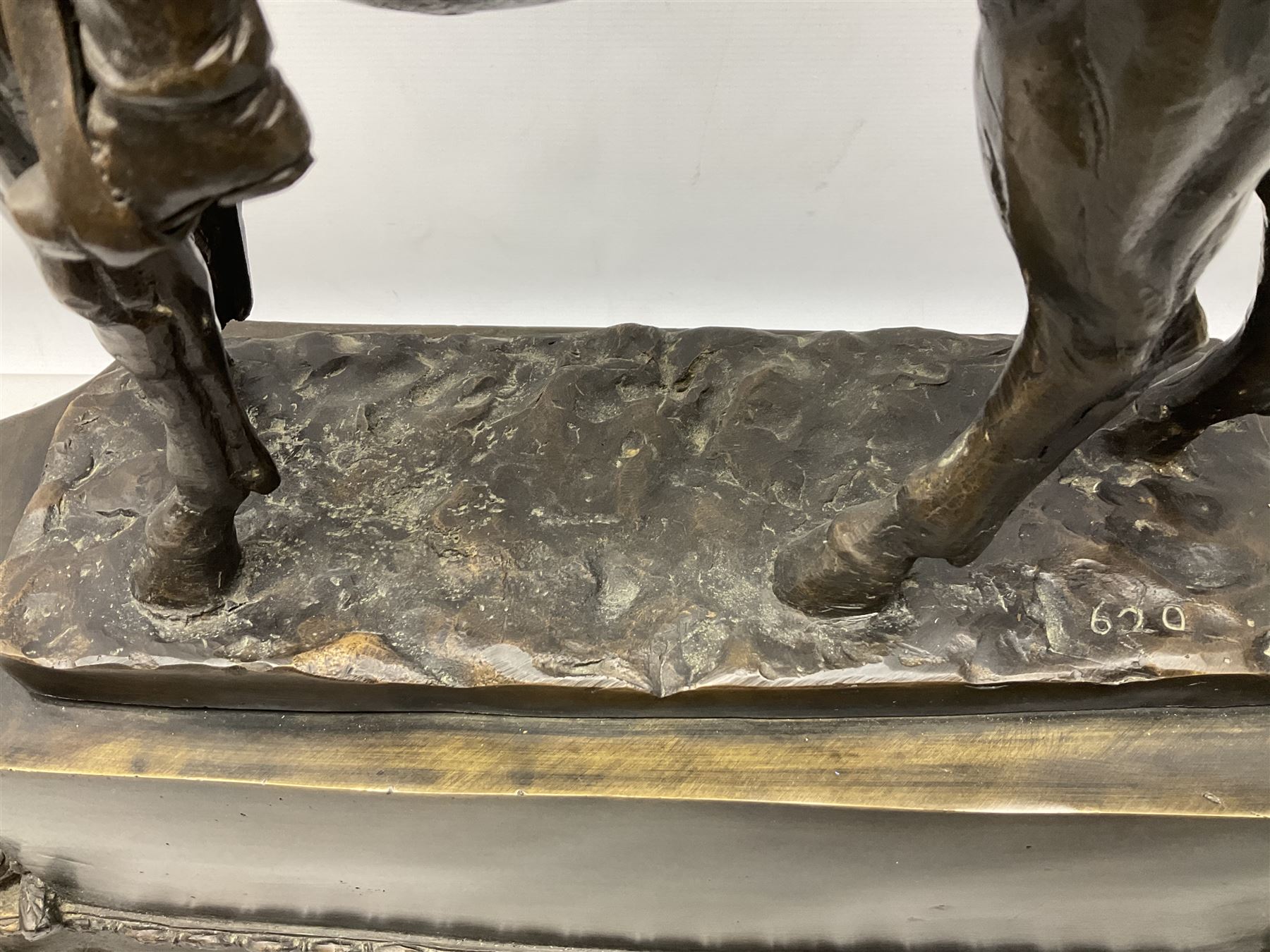 Large and impressive bronze figure of Wellington seated on a horse, on a sarcophogus shaped stepped base impressed 'Meunier Paris', the canted corners inset with battle trophies H68cm L50cm D22cm