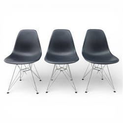 Vitra - set of six DSR side chairs designed by Charles and Ray Eames, moulded black plastic seats, raised on chromed wire Eiffel bases with plastic foot glides