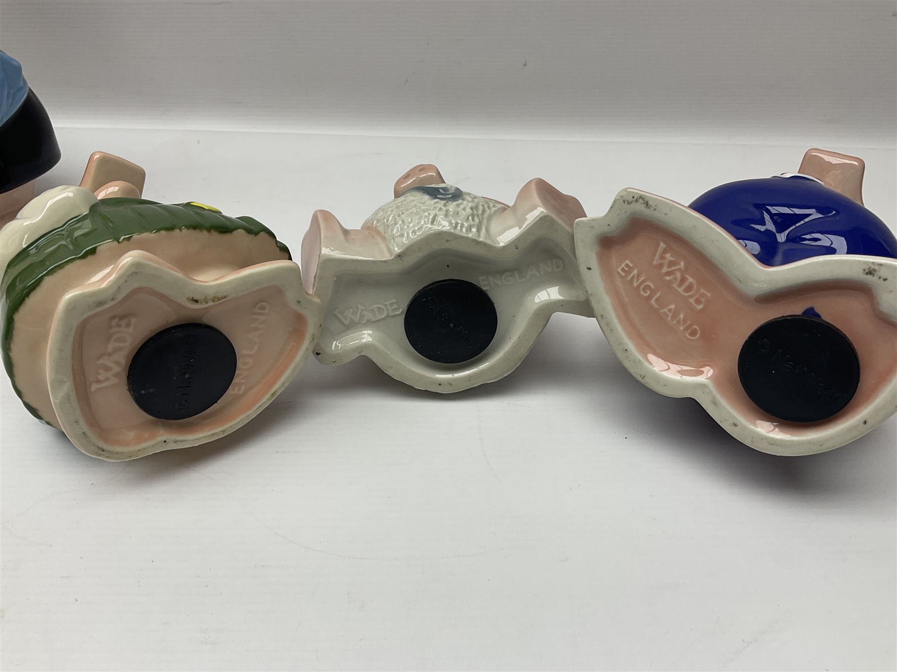 Set of five Wade NatWest money boxes, comprising father, mother, boy, girl and baby