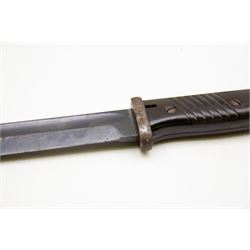 WWII German K98 bayonet by Clemen & Jung, the 24.5cm fullered blade marked 8647 h, with Bakelite grip and bluing to metal blade; in steel scabbard with corresponding numbers and leather frog, L42cm overall