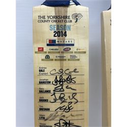 Two signed Yorkshire County cricket bats, from 2013 and 2014 seasons, bearing signatures including Johnny Bairstow, Joe Root, Tim Bresnan, Andrew Gale, etc