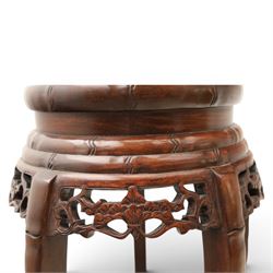 Chinese hardwood jardiniere stand, with inset black veined white marble, pierced carved apron united by rose carved undertier
