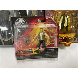 Seventeen TV & film related carded action figures comprising four Pirates of the Caribbean; five Shrek; three Star Trek; two Sea Quest DSV; Captain Scarlet, Warriors of Virtue; and Jurassic World; all in unopened blister packs (17)