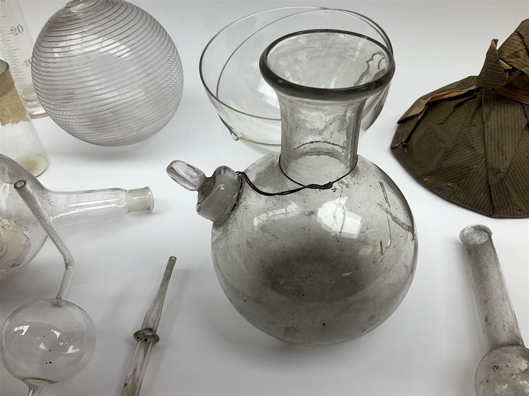 Collection of 19th century and later pharmaceutical laboratory glass, to include, volumetric flasks of various sizes, conical flask, stratus flask, etc (25) Provenance: discovered in the storeroom of a long established Hull pharmacist and opticians