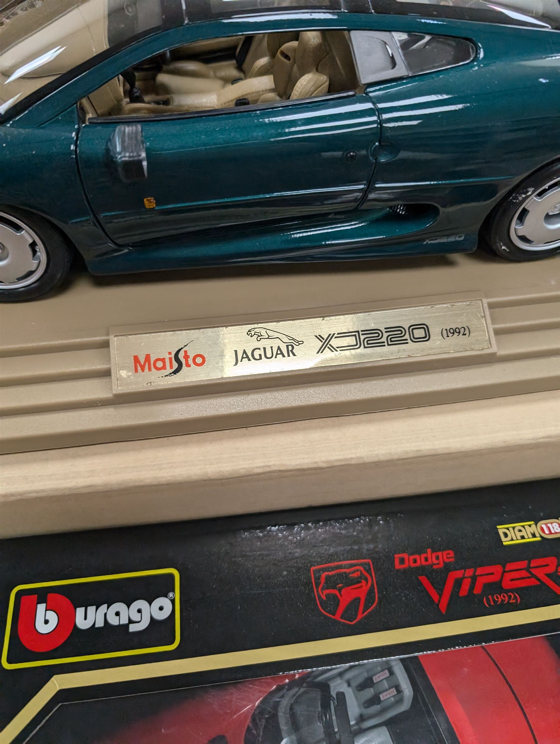 Two diecast cars, comprising Maisto 1:12 scale 1992 Jaguar XJ220 and a Burago 1:18 scale 1992 Dodge Viper RT10, both boxed