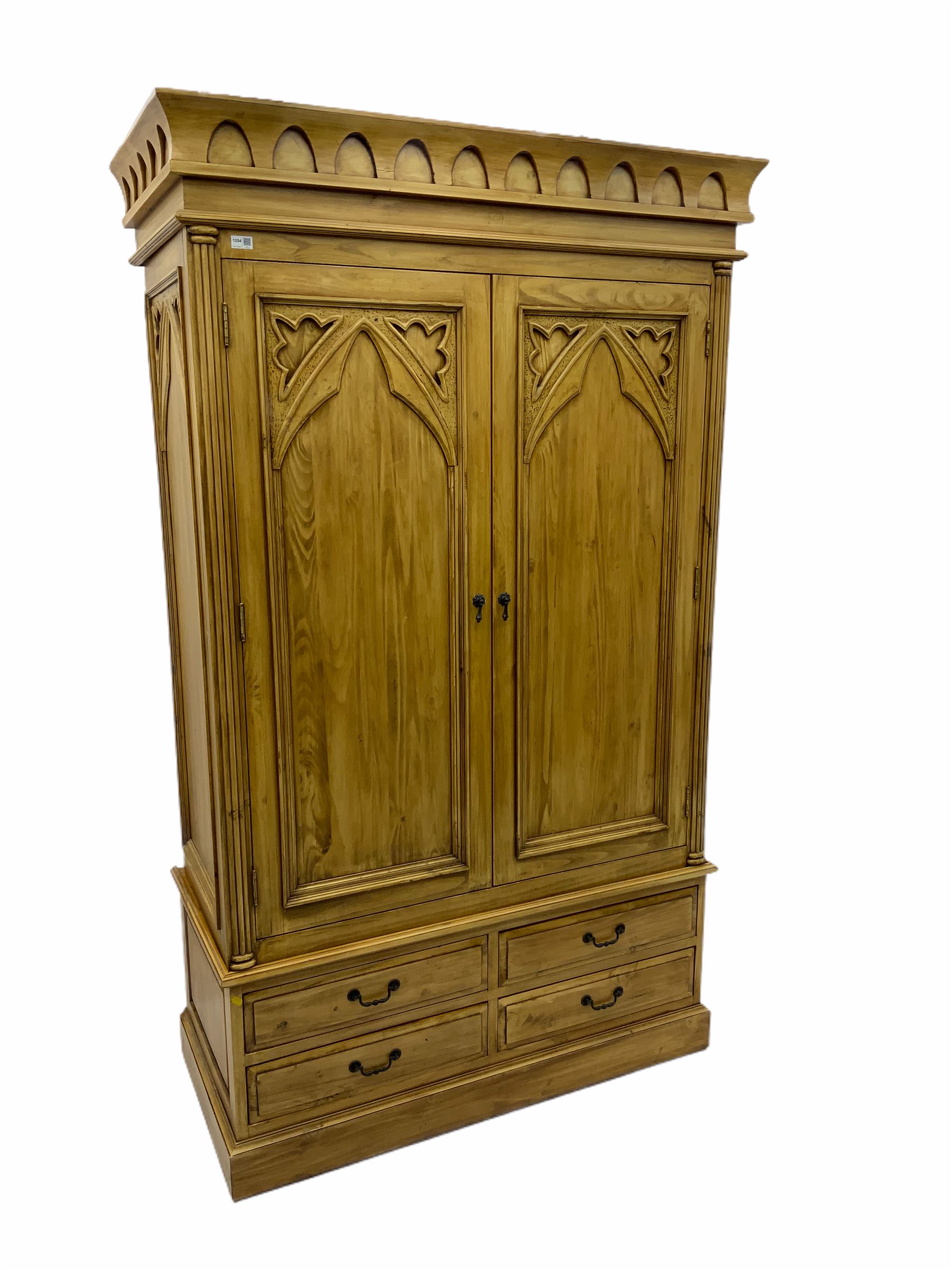 Gothic polished pine double wardrobe, fitted with four drawers