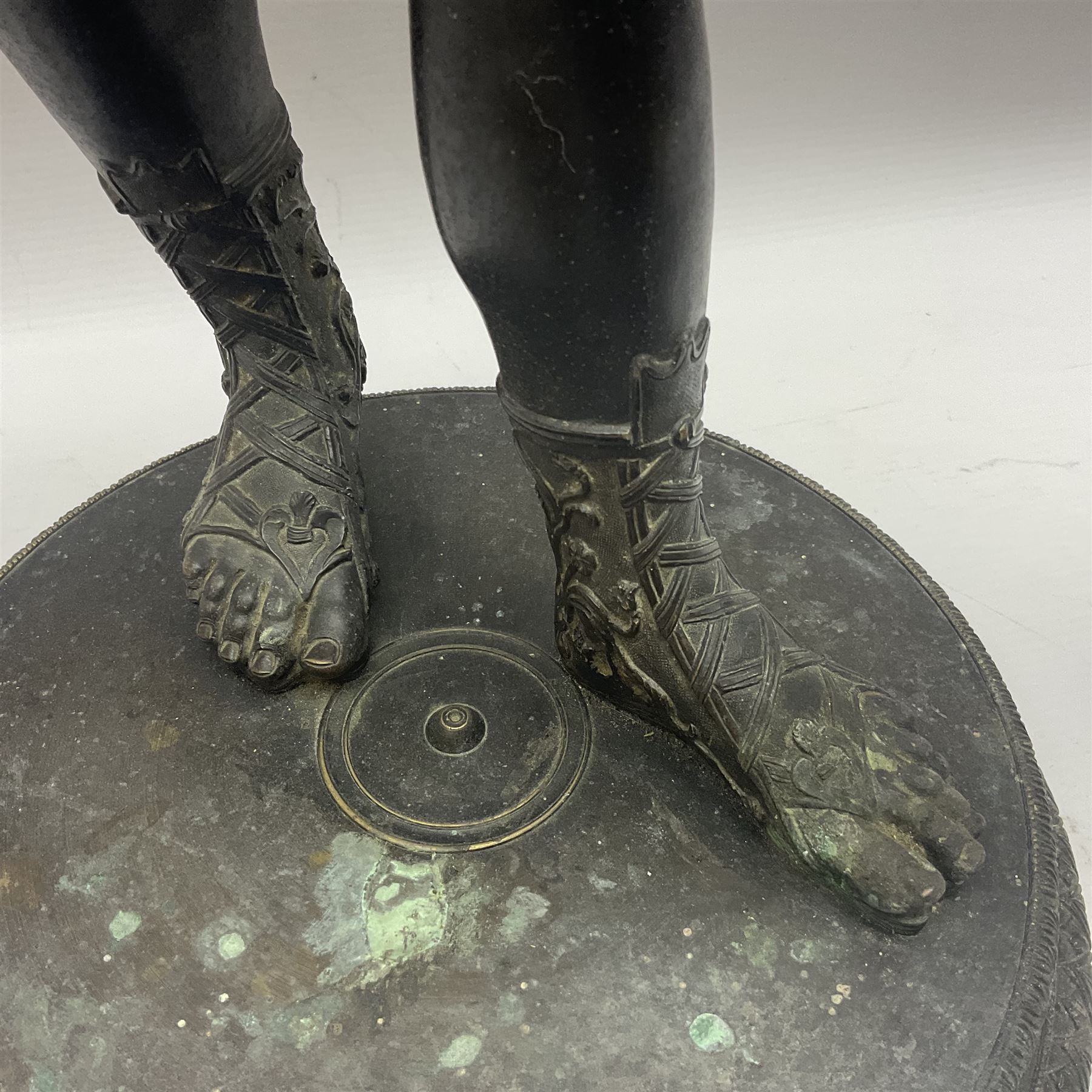 Bronzed classical nude male figure, upon a stepped circular base, H61cm 