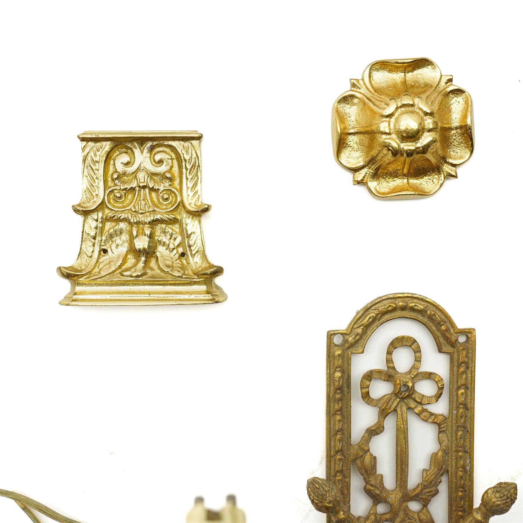 Set of eight brass cabinet door plates formed as lyres marked 'H.V' 9.5cm x 12cm, seven brass cabinet door handles of leaf design, various other handles, boss and a two branch wall light 
Provenance: property of a Nobleman