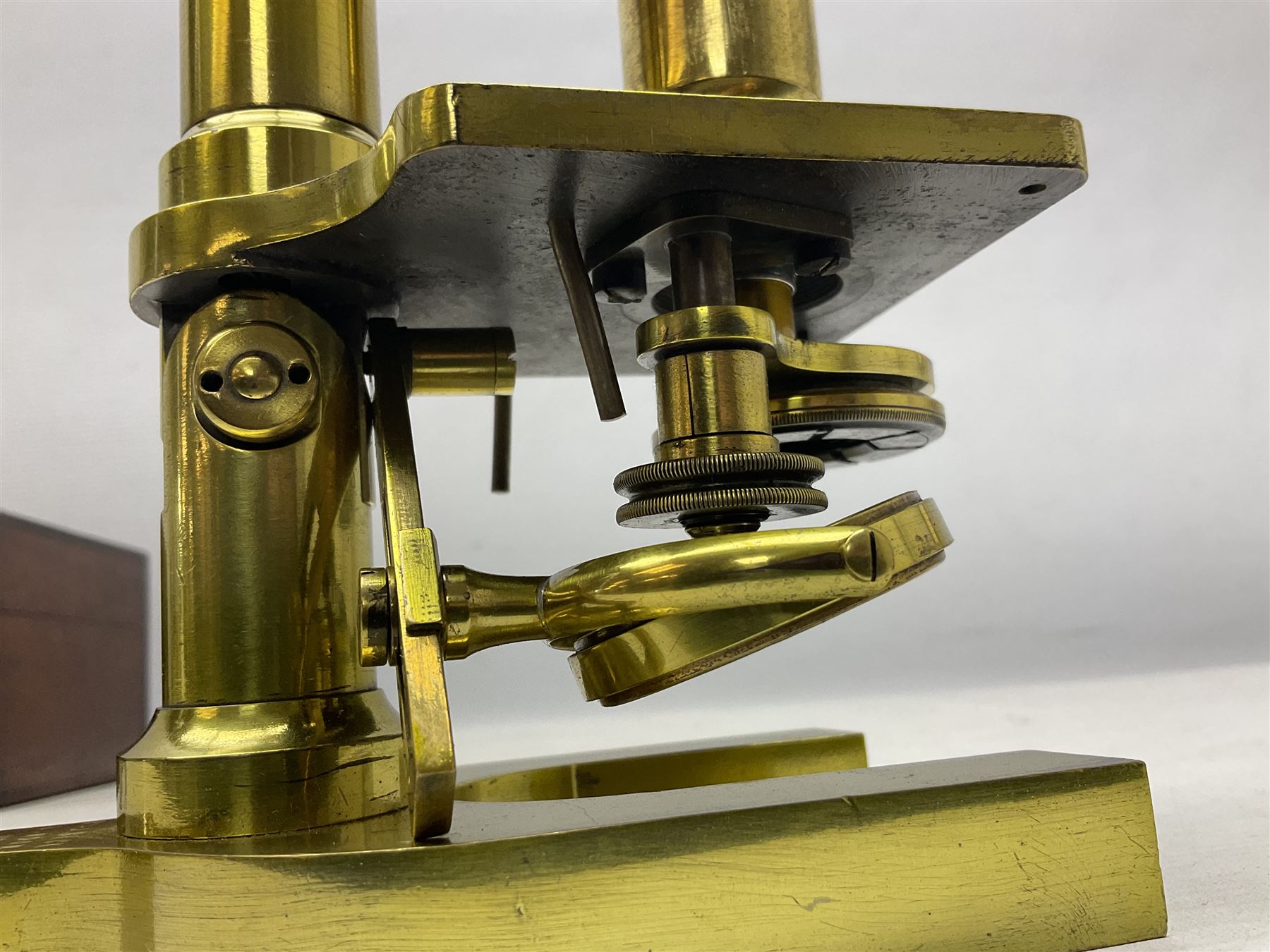 19th century brass monocular microscope by R. & J. Beck London No.18760 with hinged column and pitchfork base H25cm; in fitted mahogany case with two lenses