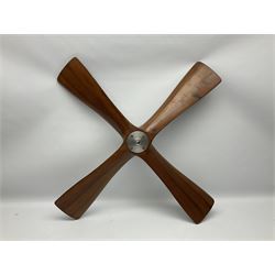 British World War II era laminated wooden four-bladed generator propeller, late 1930s-40s, used to power a drogue winch used by a target tug aircraft; marked with DRG drawing number T29505-2-4 N760 on the hub and impressed circle mark 'P.M.P.W. 1'; light weight four plank mahogany laminate with 9.5cm diameter metal plates mounted to front and rear faces of hub for 15mm shaft; one plate marked T29504-2/198 D91cm; together with a modern reproduction brass edged mahogany two-blade propellor L