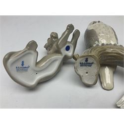 Lladro figures of animals, comprising Mini Lion no 5436, Beautiful Burro no 5683, Hawk Owl no 5422, Beagle Puppy Sitting no 1071, Duck Flying no 1264, Miniature Cat no 5308 and Small Papillon Dog no 4749, four with original boxes, largest example H14cm