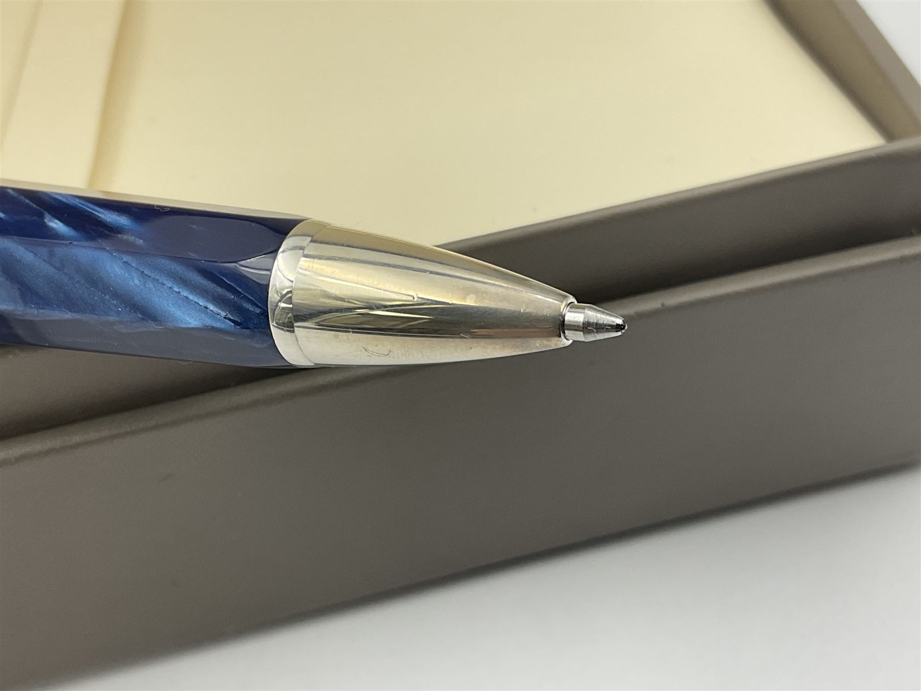 Montegrappa Emblema ball pen, the blue pearl marbled barrel of octagonal form with silver mounts and terminal with 1912 emblem, stamped 925 and clip with roller, in box, L13.5cm