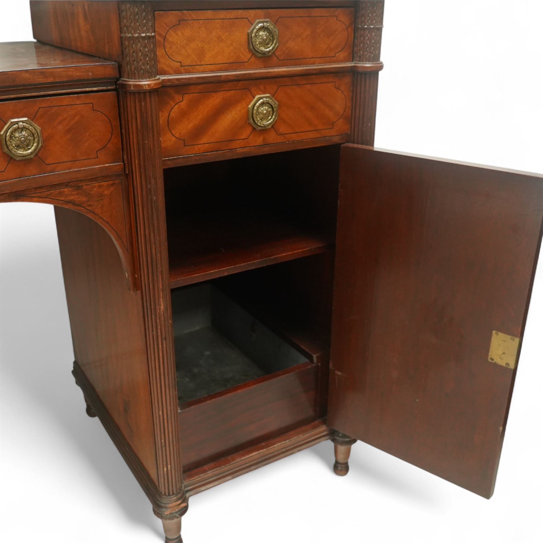 19th century mahogany Hepplewhite design pedestal sideboard or pair of bedside pedestals, each pedestal fitted with two drawers and cupboard, decorated with figured panelled doors and ebony stringing, curled leaf carved mounts over reeded half columns, on turned feet 