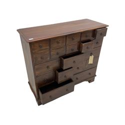 Hardwood chest fitted with eighteen drawers