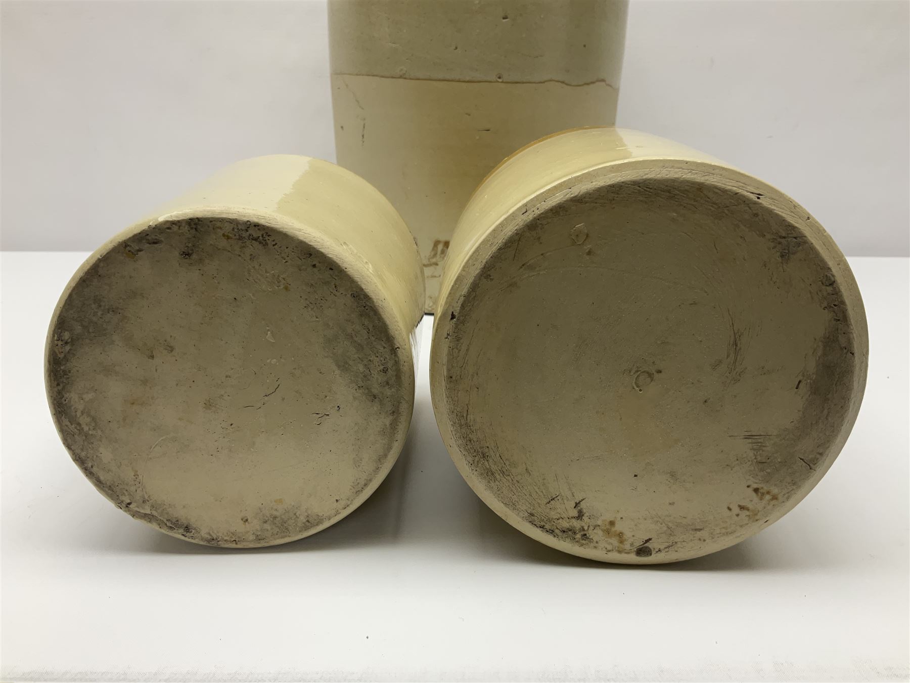 Large 2 gallon stoneware flagon, stamped 'John Soulby Wine Merchant Malton 2 Gall', together with a collection of similar stoneware jars and bottles, largest H40.5cm