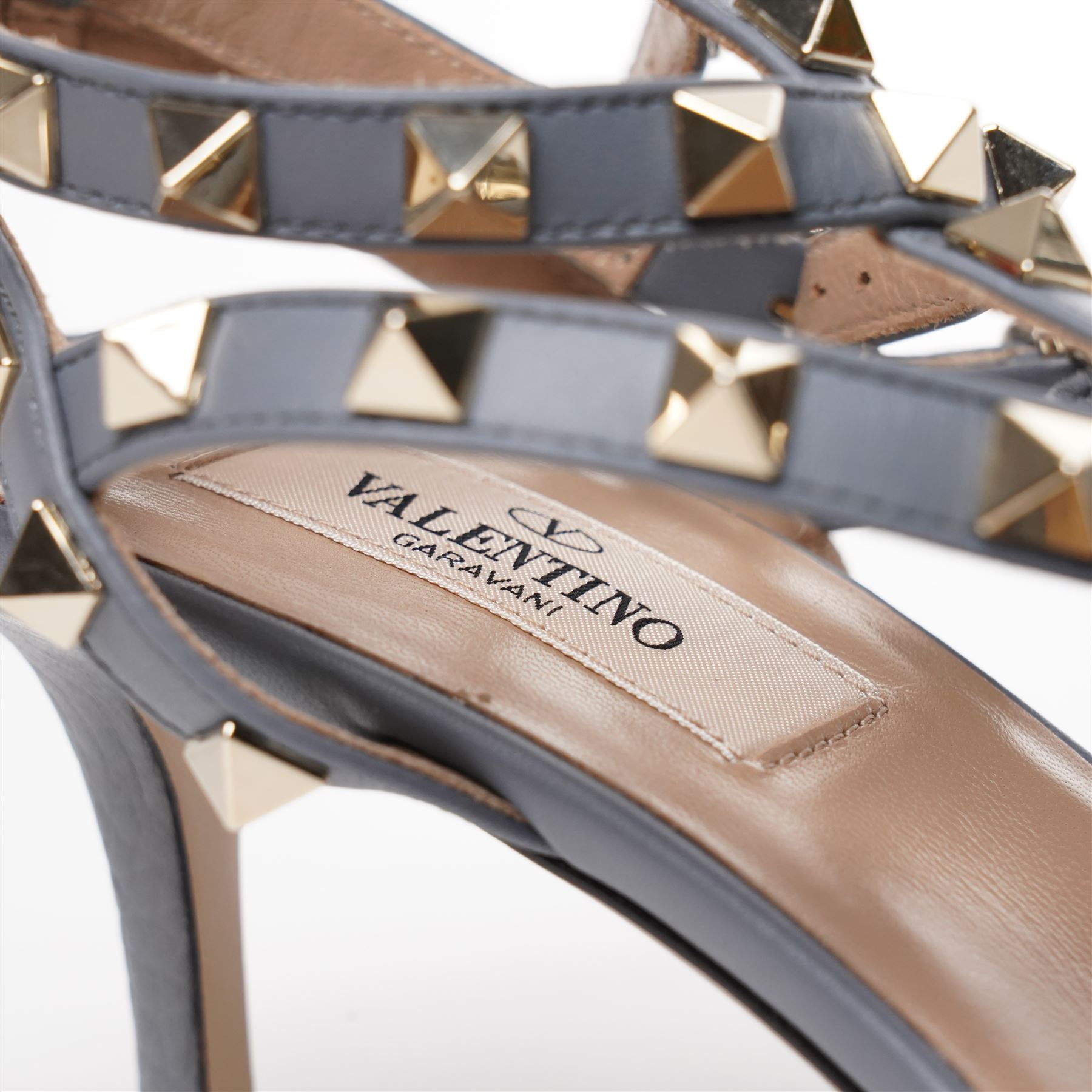 Valentino Garavani - pair of Rockstud grained leather and leather strap stiletto heels in blue, with pointed toes and gold tone pyramid stud detailing to the uppers, size 38, unused with original box and dust bag