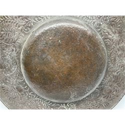 Arts and Crafts Keswick School of Industrial Arts copper charger, decorated with planished centre and repousse scrolling foliate tendrils to rim, D44cm