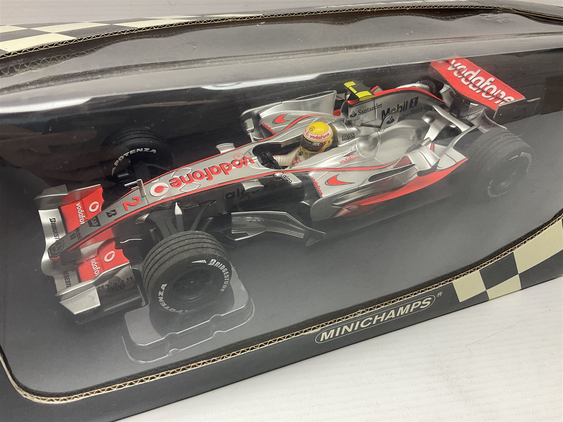 Three Minichamps 1:18 scale die-cast McLaren racing cars - Mercedes MP4-19 D. Coulthard; Mercedes MP4-20 K. Raikkonen; and Vodaphone Mercedes MP4-22 L. Hamilton 2007; all boxed (3)

