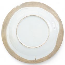 18th century English Delft charger, painted in blue with a Chinese scene with a figure in a boat, another figure crossing a bridge towards a tree and house, within a border of grapes and foliate scrolls, a similar pattern was produced by Delftfield, Glasgow, c.1760, D41cm