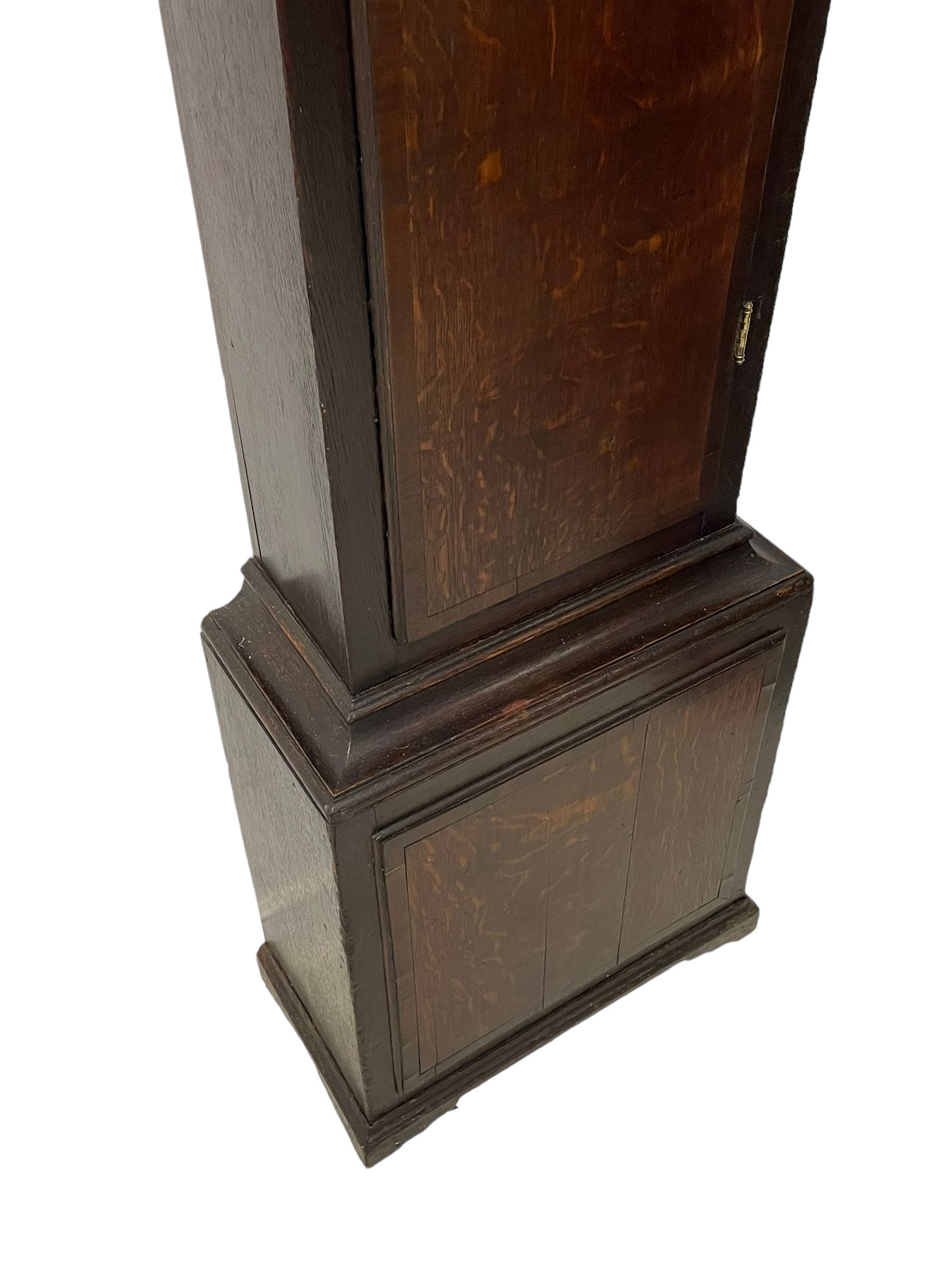 Thomas Hutchinson of Leeds - 18th century 8-day oak longcase clock with as broken arched  pediment and moulded cornice, with a conforming hood door flanked by plain turned pilasters with gesso capitals,  long trunk door with a wavy top on a square plinth with a raised panel, brass dial with cast spandrels,  engraved silvered dial centre and chapter ring with Roman numerals, five minute Arabic's and minute track, with pierced steel hands, seconds pointer,  arched calendar aperture and silvered boss engraved with the makers name to the break arch, dial pinned to a rack striking two train movement with a recoil anchor escapement. With weights and pendulum. Thomas Hutchinson is recorded as working in Leeds from 1760-90.