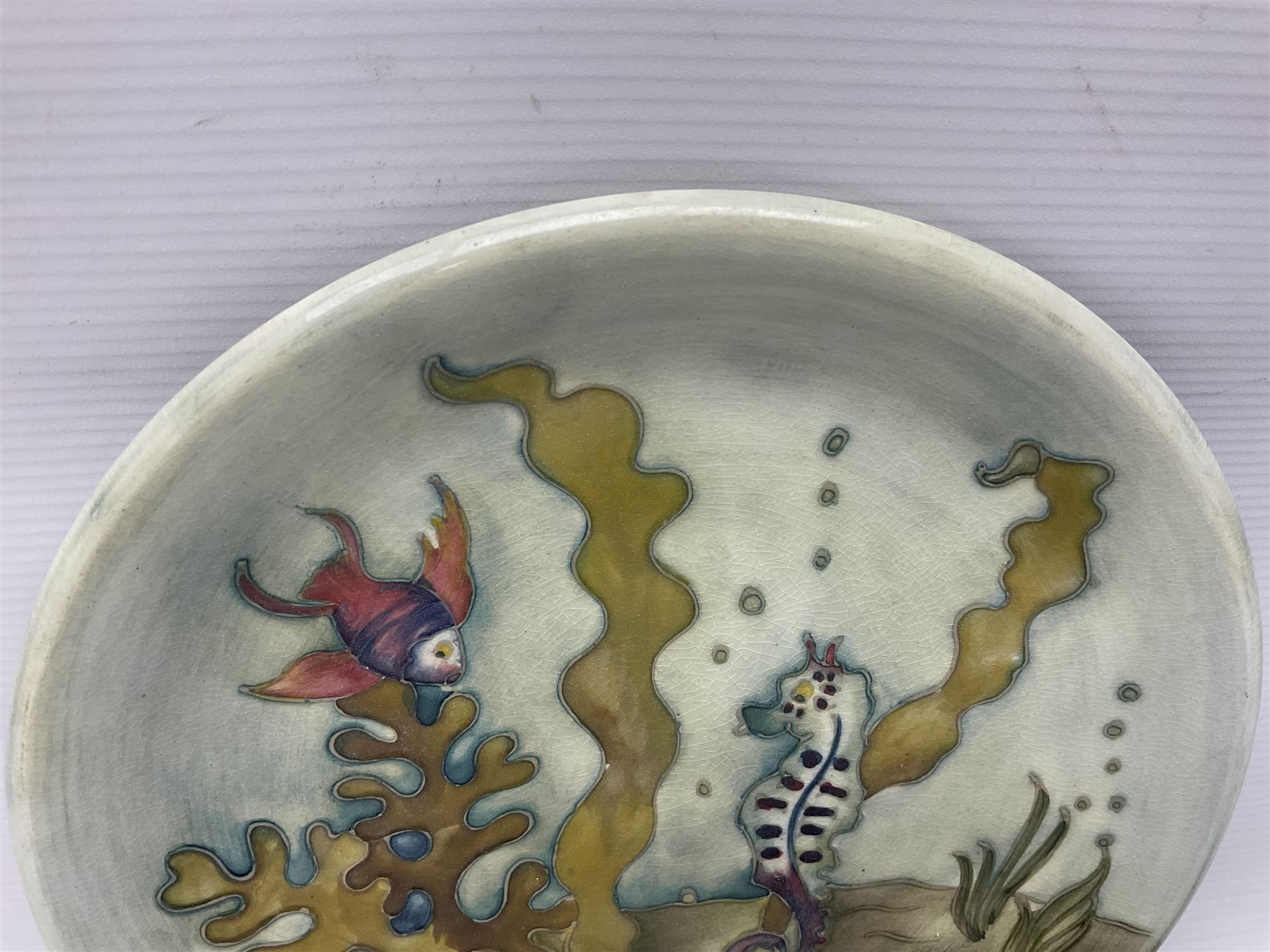 Moorcroft charger decorated in Seahorse pattern, circa 1960, with painted and impressed marks beneath, D26cm
