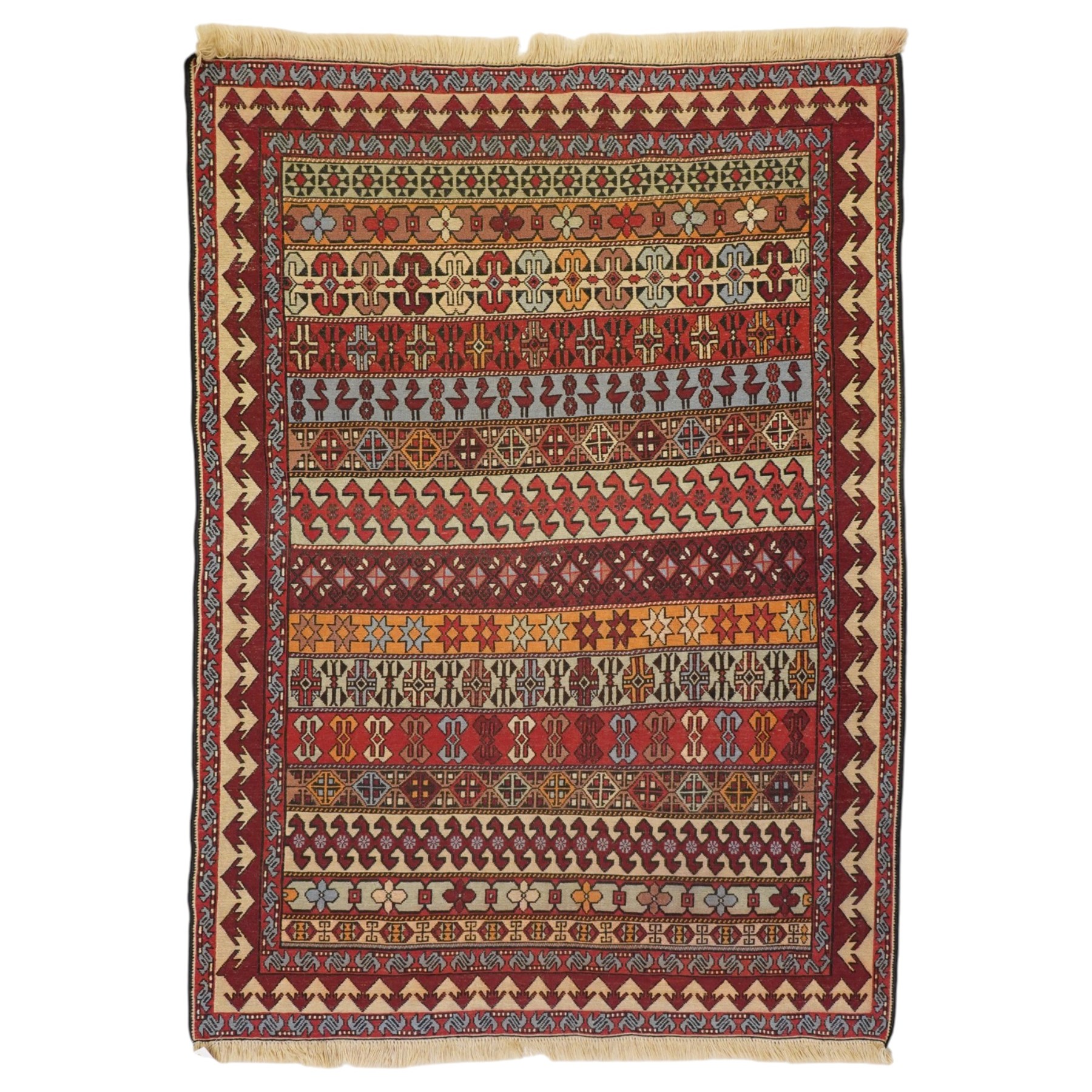 
Oman tribal design rug, field decorated with horizontal bands of stylised birds, flowerheads, stars and hooked geometric motifs in red, ivory, ochre and pale blue, enclosed by serrated ivory and red borders and narrow patterned guard stripes
