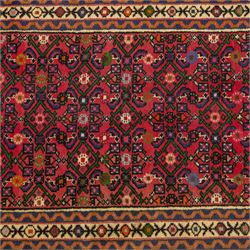 North West Persian runner, red field decorated with repeating herati motifs and small flowerheads, enclosed by cream main border with stylised floral motifs and narrow guard borders, fringed ends