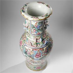 Large pair of 19th century Cantonese famille rose vases, each painted with various courtly scenes, including a display of warriors fighting on horseback before an official and his attendants, double Buddhist lion handles and applied at the shoulders with chilong, the lower band painted with Greek key motif, H58cm (2)