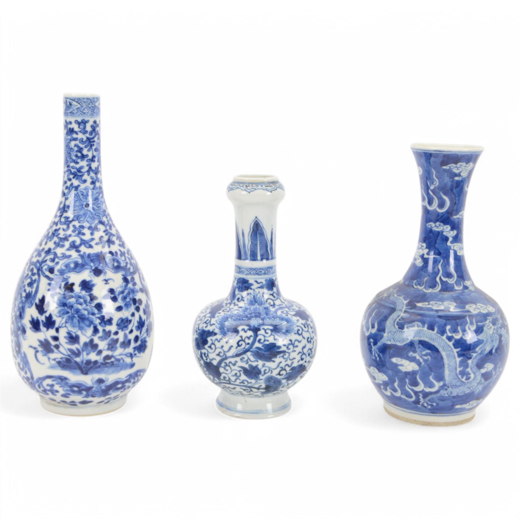 Chinese blue and white vase, decorated with a dragon chasing a flaming pearl amongst stylised clouds, together with two other vases, largest H26cm 