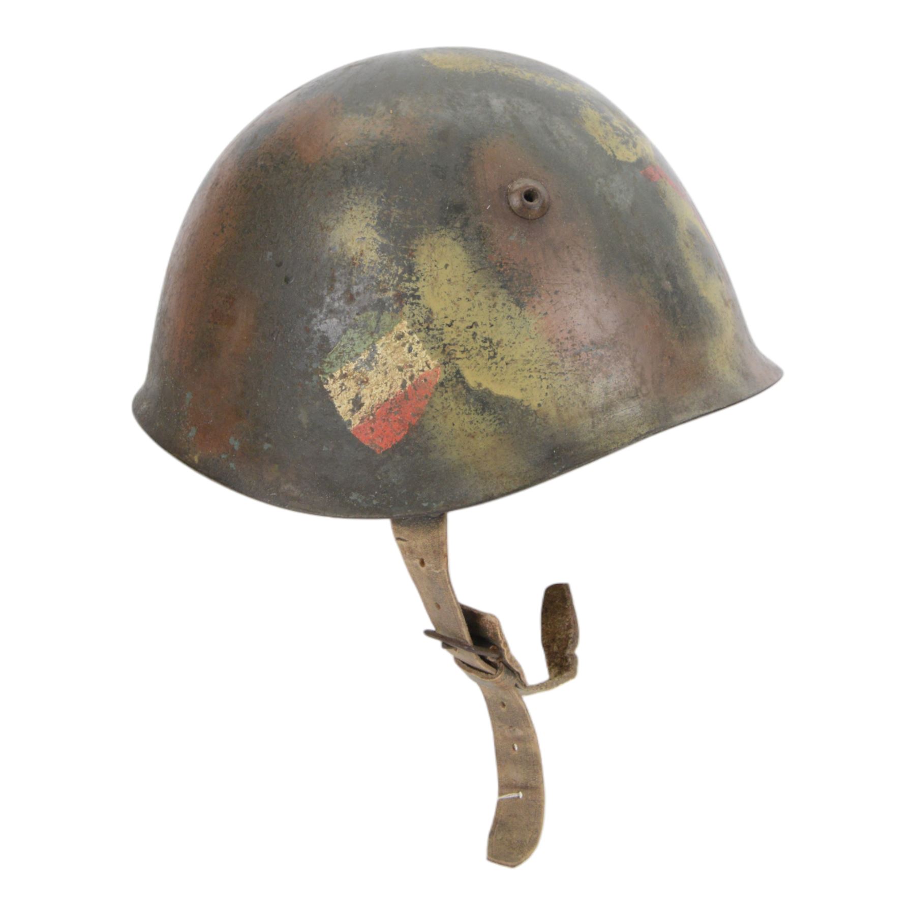 Italian RSI/10th M.A.S. Flotilla (Decima Flottiglia MAS). M33 Camouflage helmet- re-issued to the G.N.R. Circa.1944/45
extremely rare Italian M33 steel helmet in camouflage paintwork which belongd to the famous 'Decima Flottiglia MAS' the Italian Elite Naval Commandos. The helmet retains the Italian tri-colour to oneside, the yellow anchor to the front and the red X to the other side. the helmet is complete with its correct liner and chinstrap. When it was re-isseued it was painted in camouflage with the new insignia to the front of the G.N.R. 'Guardia Nazionale Republican' and this camouflage was only used to the latter part of WWII by R.S.I (Repubblica Sociale Italiana)   