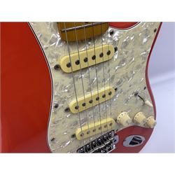 Japanese Squier Fender 'Hank Marvin' Stratocaster electric guitar, c1992, in Fiesta red with tremolo arm and facsimile signature decal; serial no.L037281, L98cm; in hard carrying case.