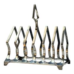 Modern silver plated Barker Ellis pitcher, with oblique gadrooned rim and acanthus capped C scroll handle, an egg coddler with part fluted body and urn finial and other silver plated items including toast rack, two serving dishes, etc, coddler H23.5cm