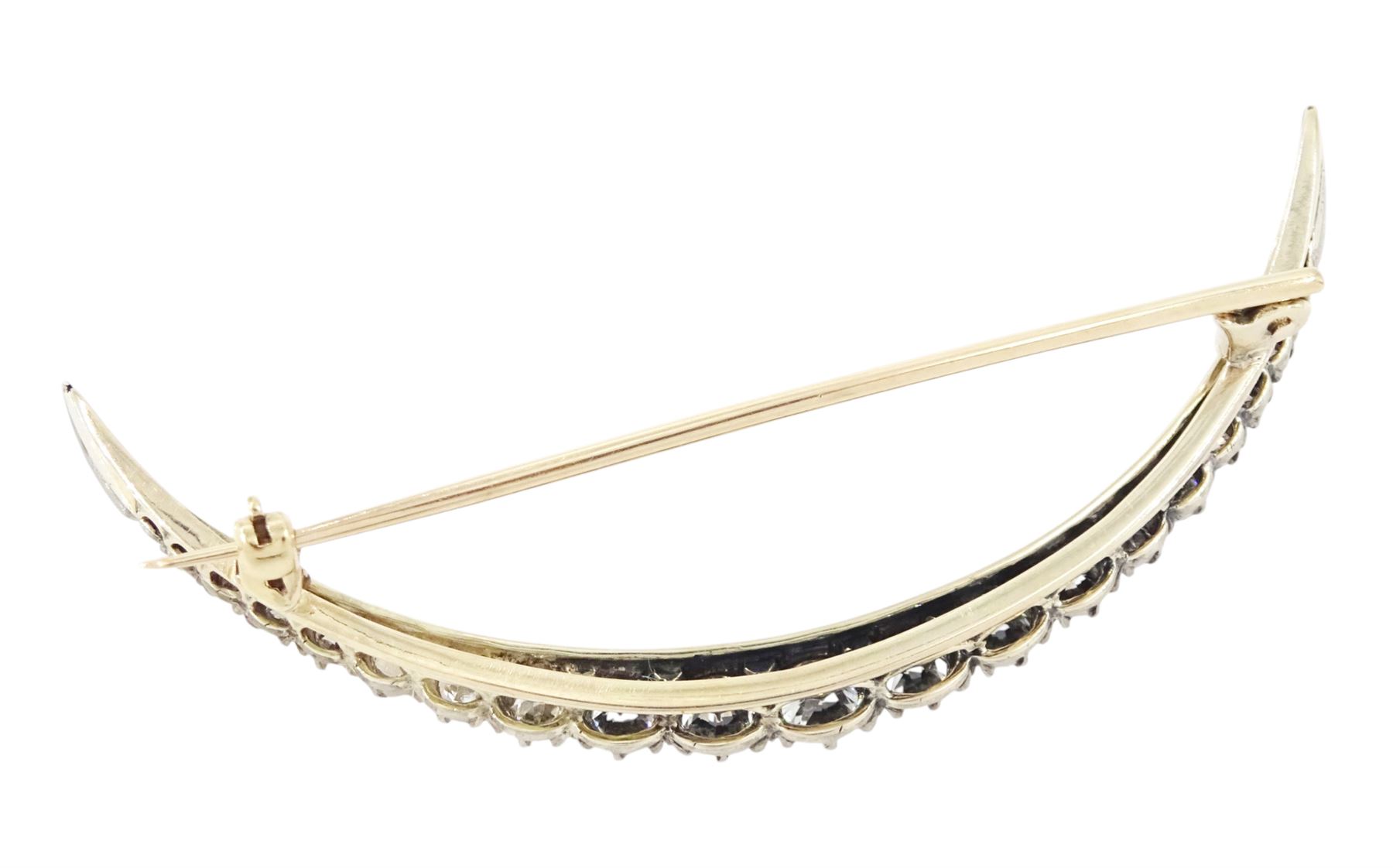 19th century silver and gold diamond crescent moon brooch, set with twenty-one graduating old cut diamonds and six rose cut diamonds, total diamond weight approx 2.00 carat